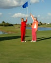 Happy lady golfers celebrate Royalty Free Stock Photo