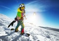 Happy lady snowboarder with snow kite Royalty Free Stock Photo