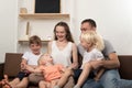 Happy large family at home. Parents and three small children Royalty Free Stock Photo