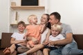 Happy large family at home. Parents and three small children are fun Royalty Free Stock Photo