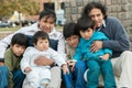 Latin family sitting in the street Royalty Free Stock Photo