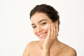Happy Latin girl freckled face applying facial cream isolated on white. Portrait Royalty Free Stock Photo