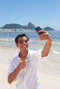 Happy latin guy making selfie at Copacabana beach Royalty Free Stock Photo