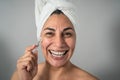 Happy Latin mature woman having skin care spa day