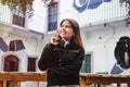 Happy latin teenager girl listening music in headphones in Mexico city