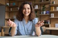 Happy latin young woman online teacher or student talking to camera. Royalty Free Stock Photo