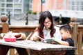 Happy latino family reading book Royalty Free Stock Photo