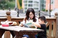 Happy latino family reading book Royalty Free Stock Photo