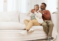 Happy, laugh and senior couple hug on sofa with conversation, care and romance in their home. Smile, embrace and elderly Royalty Free Stock Photo