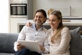 Happy bonding couple using digital tablet at home. Royalty Free Stock Photo