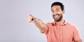 Happy, laughing and Asian man pointing for bullying isolated on a grey studio background. Funny, joke and Japanese with Royalty Free Stock Photo