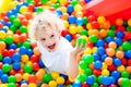 Child playing in ball pit on indoor playground Royalty Free Stock Photo