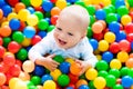 Child playing in ball pit on indoor playground Royalty Free Stock Photo