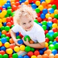 Child playing in ball pit on indoor playground Royalty Free Stock Photo