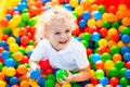 Child playing in ball pit on indoor playground