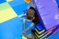 Boy having fun in kids amusement park and indoor play center. Child playing with colorful toys in playground. Royalty Free Stock Photo