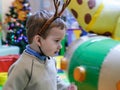 Boy having fun in kids amusement park and indoor play center. Child playing with colorful toys in playground Royalty Free Stock Photo