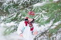 Happy laughing boy playing in a snowy forest Royalty Free Stock Photo