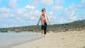 Happy laughing boy running on the sandy sea beach. Concept of tourism, travel, summer vacation Royalty Free Stock Photo