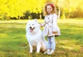 Happy laughing child and dog having fun outdoors Royalty Free Stock Photo