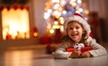 Happy laughing child girl with christmas present Royalty Free Stock Photo