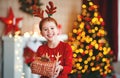 Happy laughing child girl with christmas present Royalty Free Stock Photo