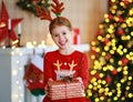 Happy laughing child girl with christmas present Royalty Free Stock Photo