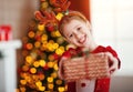 Happy laughing child girl with christmas present Royalty Free Stock Photo