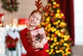 Happy laughing child girl with christmas present Royalty Free Stock Photo