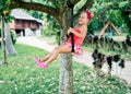 Happy laughing child girl on swing outdoors Royalty Free Stock Photo