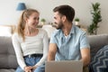 Happy laughing couple using laptop together, shopping, surfing internet Royalty Free Stock Photo