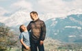 Happy laughing father and son hiking in mountains Royalty Free Stock Photo