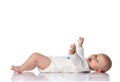 Laughing infant baby toddler in white bodysuit is lying on his back, holding hands up, waving, happy screaming on white Royalty Free Stock Photo