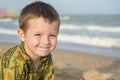 Happy laughing kid on sand beach Royalty Free Stock Photo