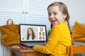 Happy laughing kid studying with laptop at home Royalty Free Stock Photo