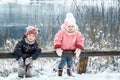 Happy laughing kids in a beautiful snowy winter forest Royalty Free Stock Photo