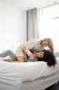 Happy, laughing and a lesbian couple in the bedroom in the morning for love and bonding. House, romance and gay or lgbt Royalty Free Stock Photo