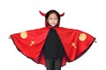 Happy laughing little Asian child girl dressed Halloween costume. Kid in Dracula robe on white background