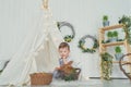 Happy laughing little boy playing with a baby rabbit, hugging real bunny pet and learning to take care of an animal Royalty Free Stock Photo