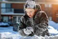 Happy laughing little girl wearing playing and running in a beautiful snowy winter park soft sharpness, focus Kids play outside Royalty Free Stock Photo