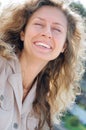 Happy laughing long blond hair young woman