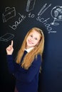 laughing school child near school blackboard