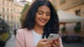 Happy laughing smiling portrait Indian Arabian ethnic woman girl female student businesswoman walking city street Royalty Free Stock Photo