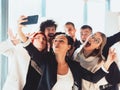 Happy laughing team diverse colleagues posing for selfie portrait in office, friendly group of corporate employees of Royalty Free Stock Photo