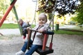 Brother and Sister Having Fun on a Swing Royalty Free Stock Photo