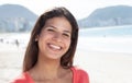 Happy laughing woman with dark hair at beach Royalty Free Stock Photo