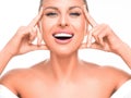 Happy laughing woman enjoying in her healthy skin. Woman touching her face. Royalty Free Stock Photo