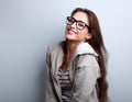 Happy laughing woman in eyeglasses on blue background Royalty Free Stock Photo