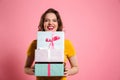 Happy laughing woman with red lips holding bunch of gift boxes, Royalty Free Stock Photo