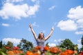 Happy laughing woman in a sunny day in nature in summer with open hands Royalty Free Stock Photo